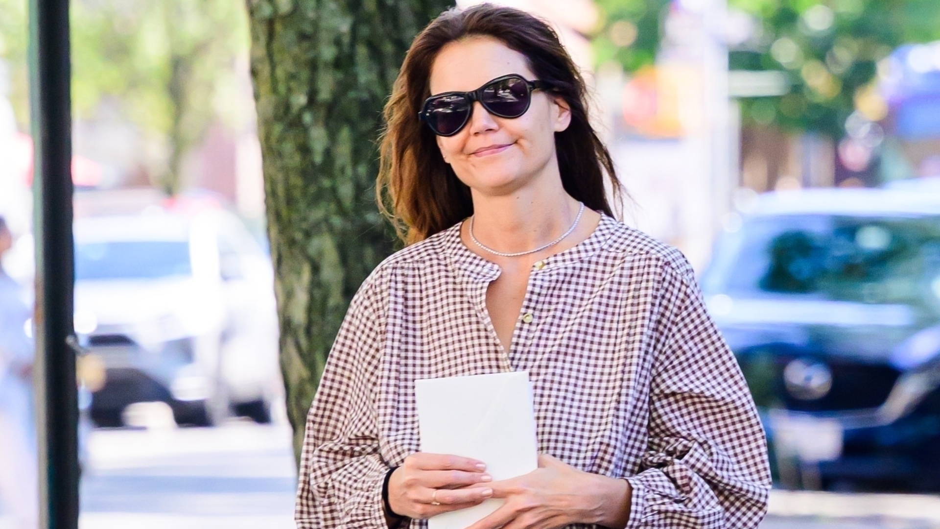 Katie Holmes wore the Chloé Kick Sneakers with the gingham trend
