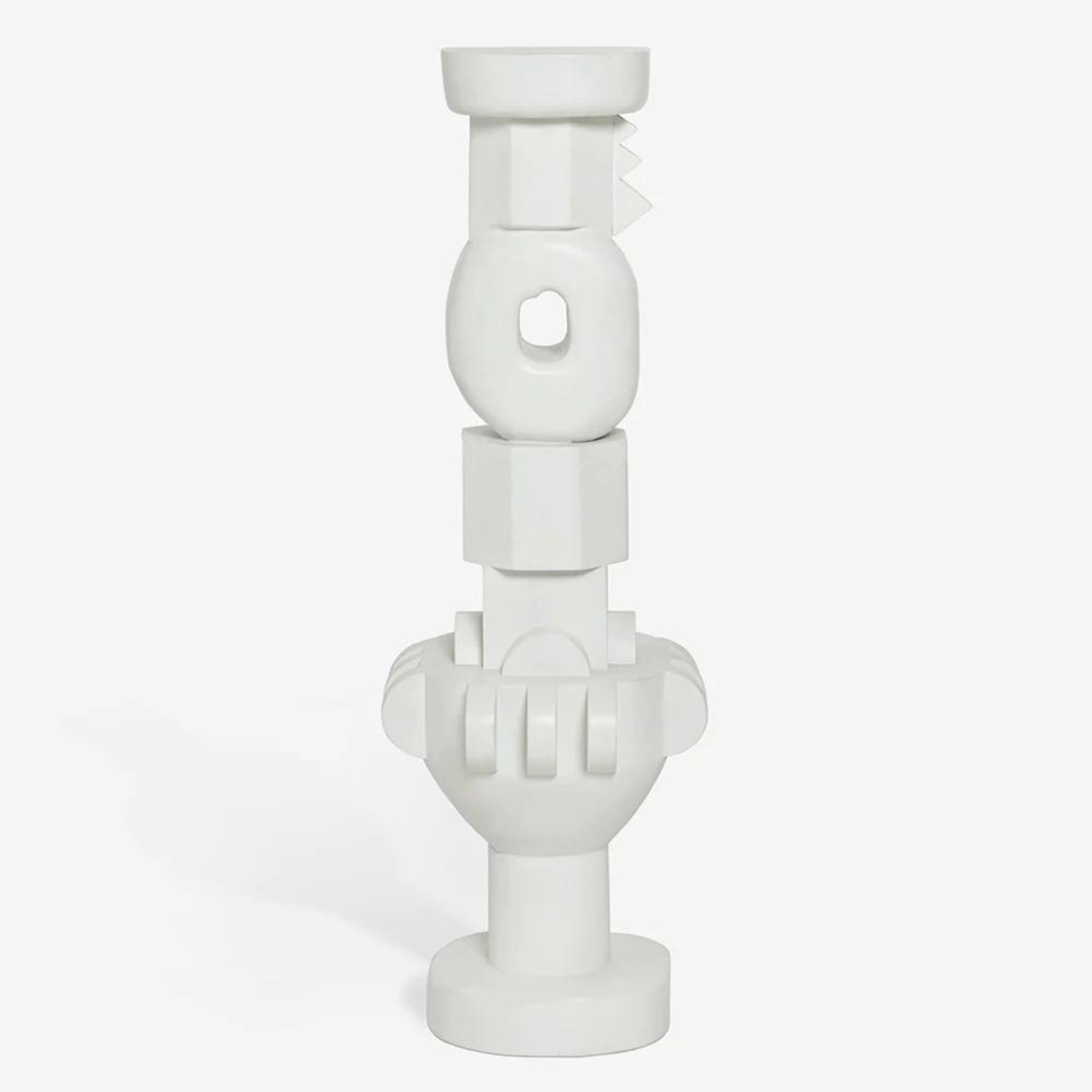 A white, sculptural plant holder