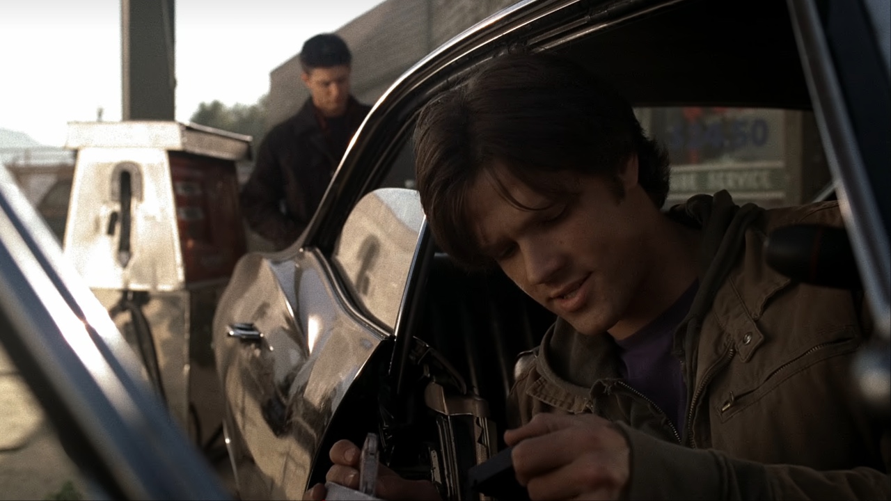 Sam looking through Dean&#039;s box of cassette tapes in Supernatural Season 1x01