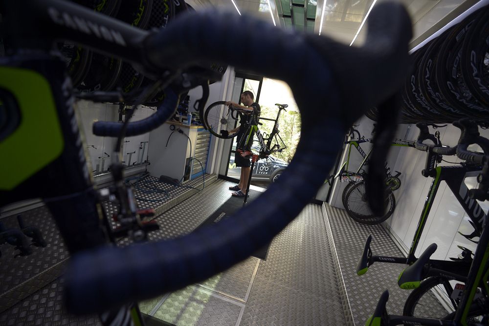 Movistar mechanics catch up on fine tuning the team's machines.