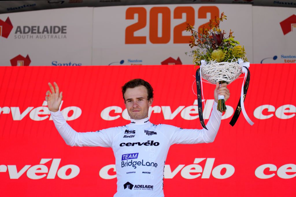 LOBETHAL AUSTRALIA JANUARY 27 Matt Dinham of Australia and Team Bridgelane celebrates at podium winning the white best young rider jersey during the 2nd Santos Festival Of Cycling 2022 Mens Elite Stage 1 a 1142km stage from Stirling to Lobethal TourDownUnder on January 27 2022 in Lobethal Australia Photo by Daniel KaliszGetty Images