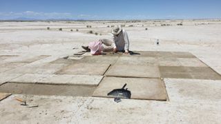 Archaeologists found charred tobacco seeds in the remains of a hearth in Great Salt Lake Desert in Utah, dating back more than 12,000 years. Here, Kelly McGuire is digging at the hearth.