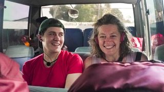 Dylan Llewellyn and his mum Jackie smiling on a bus in Celebrity Race Across the World season 3