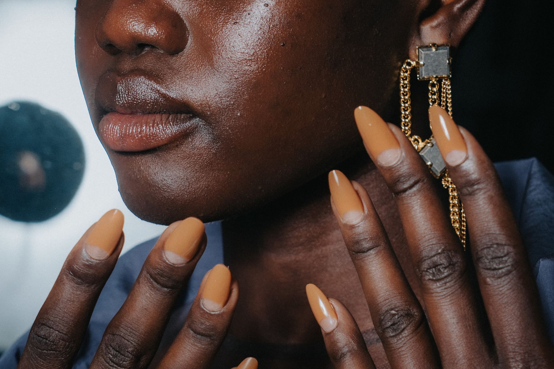Various women with neutral colored manicures. 