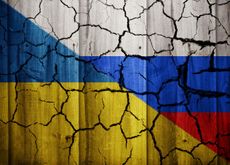A mockup image depicting a fractured relationship between Ukraine and Russia with cracks appearing across both flags