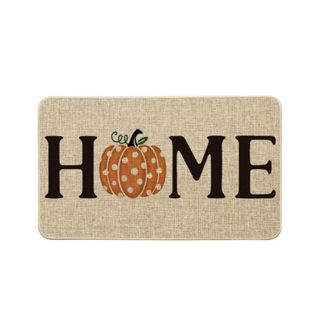 A cream door mat that says 'home'