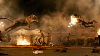 A man leaps forward to engage a tiger in Netflix's RRR movie