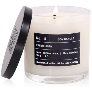 A white candle with black label