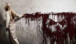 woman smears blood on wall sinister
