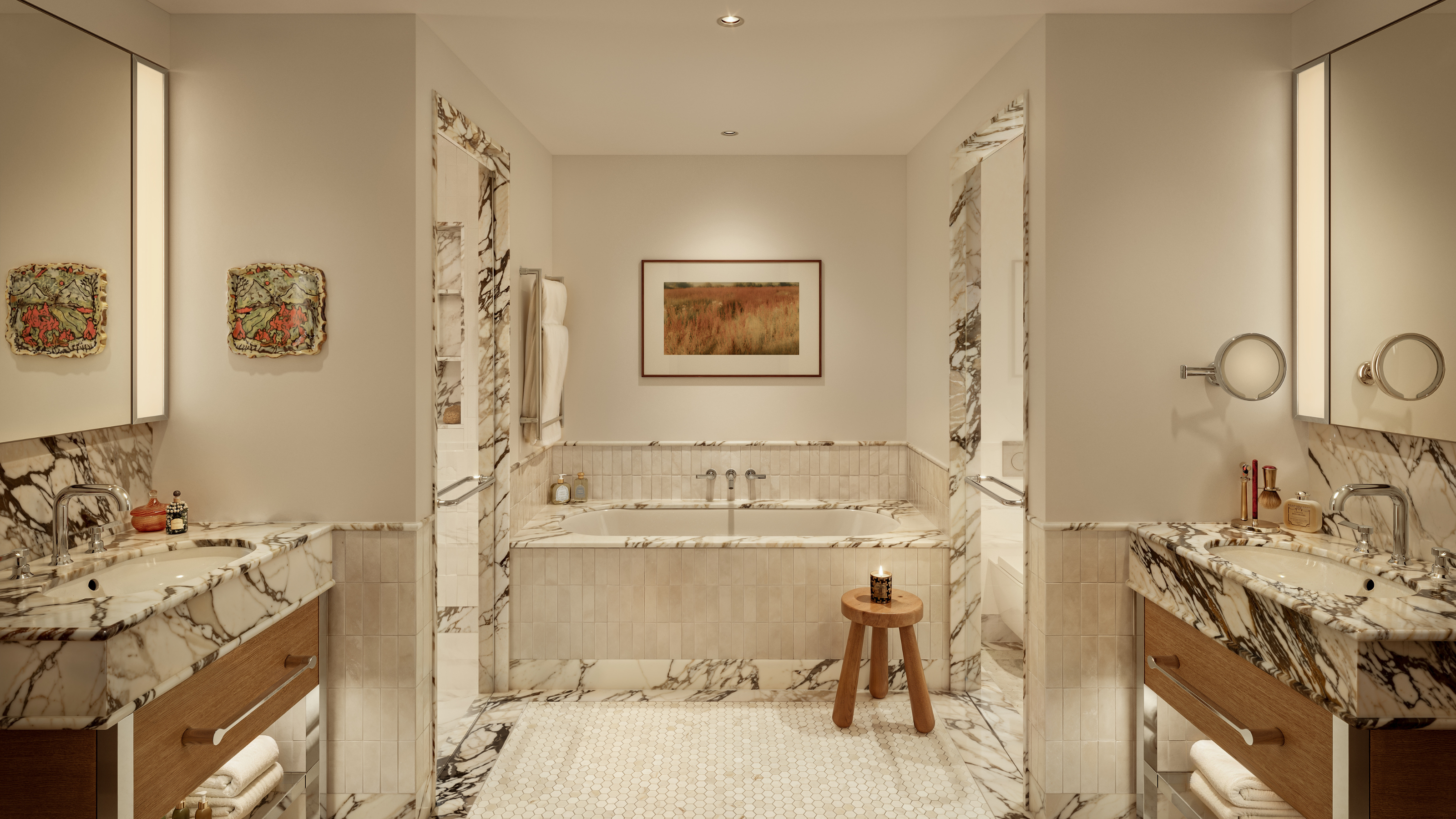 marble bathroom with double vanities, a built-in tub, and marble architraves around the doorways