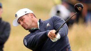 Photo of Bryson DeChambeau hitting a fairway wood