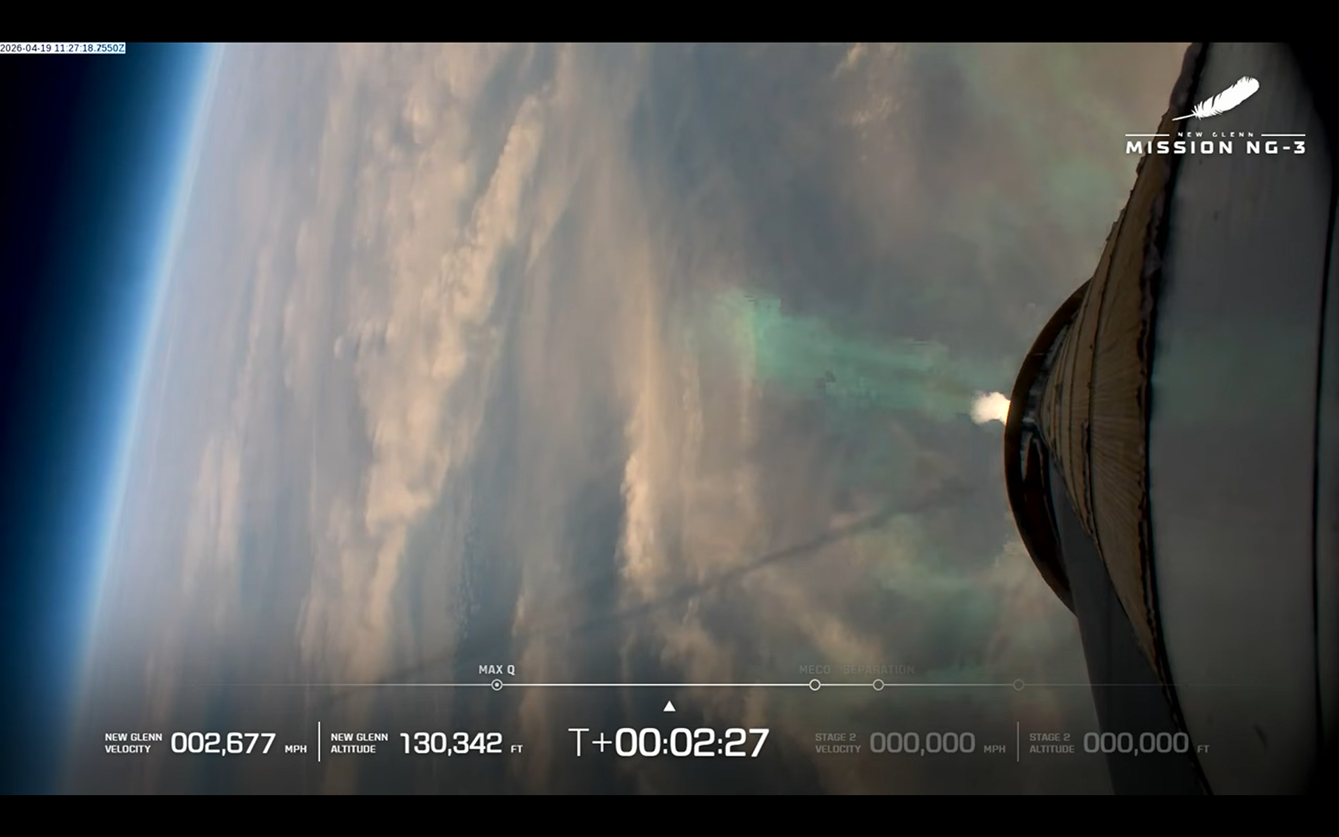 A view of Earth during the launch of Blue Origin's NG-New Glenn rocket as seen from the booster. The shadow of its exhaust plume is visible across the left side of the image.