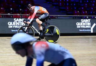 Philip Heijnen in an orange skinsuit at the UCI Track Champions League