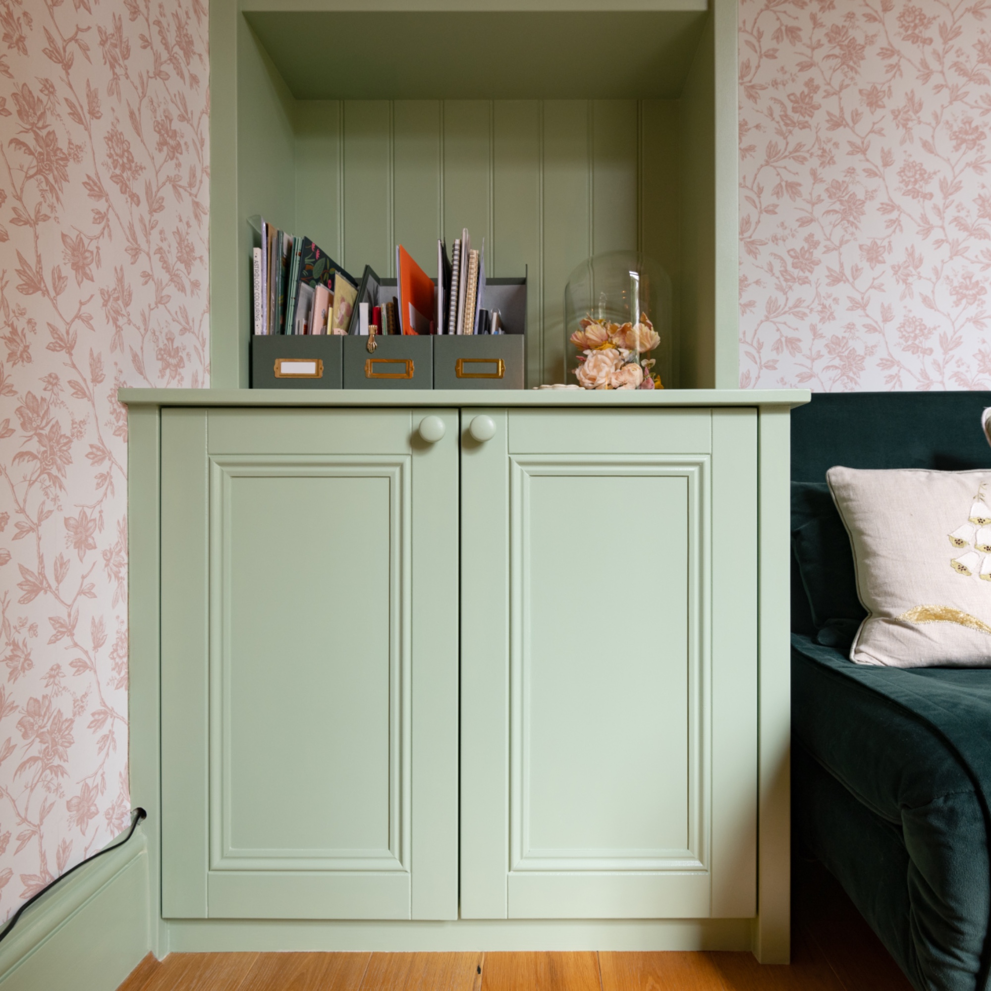 pale green bespoke cabinetry with tongue and groove shelving above