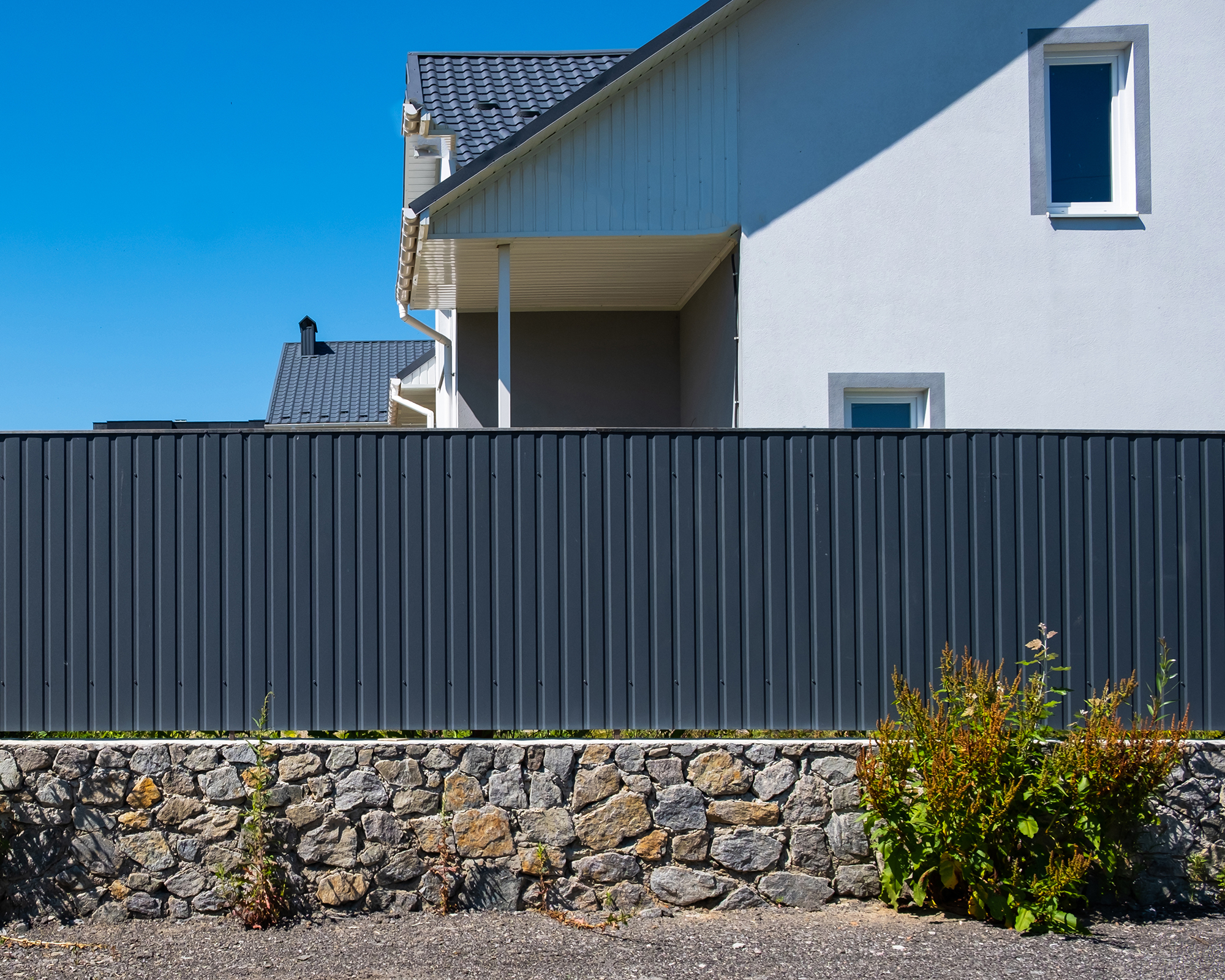 Corrugated metal fence