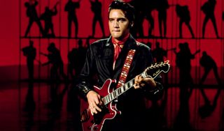 Elvis Presley performs with a Hagstrom Viking II in 1968