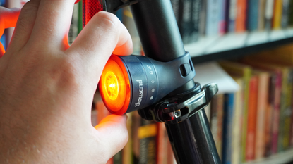 The Thousand Traveler bike lights attach via a magnet and twist-lock.