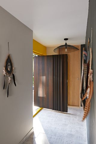 a pivot front door made from timber