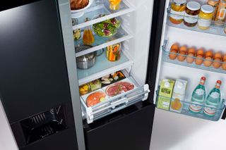 a fridge with vacuum compartments
