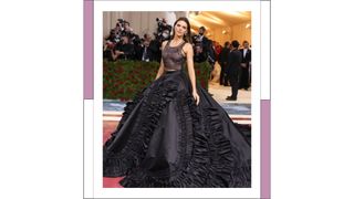 Kendall Jenner sports bleached eyebrows and wears black gown, with a sheer top and ruffled skirt as she attends The 2022 Met Gala Celebrating "In America: An Anthology of Fashion" at The Metropolitan Museum of Art on May 02, 2022 in New York City.