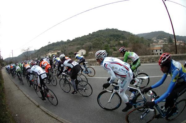 The peloton tries to stay warm on a brutal winter day