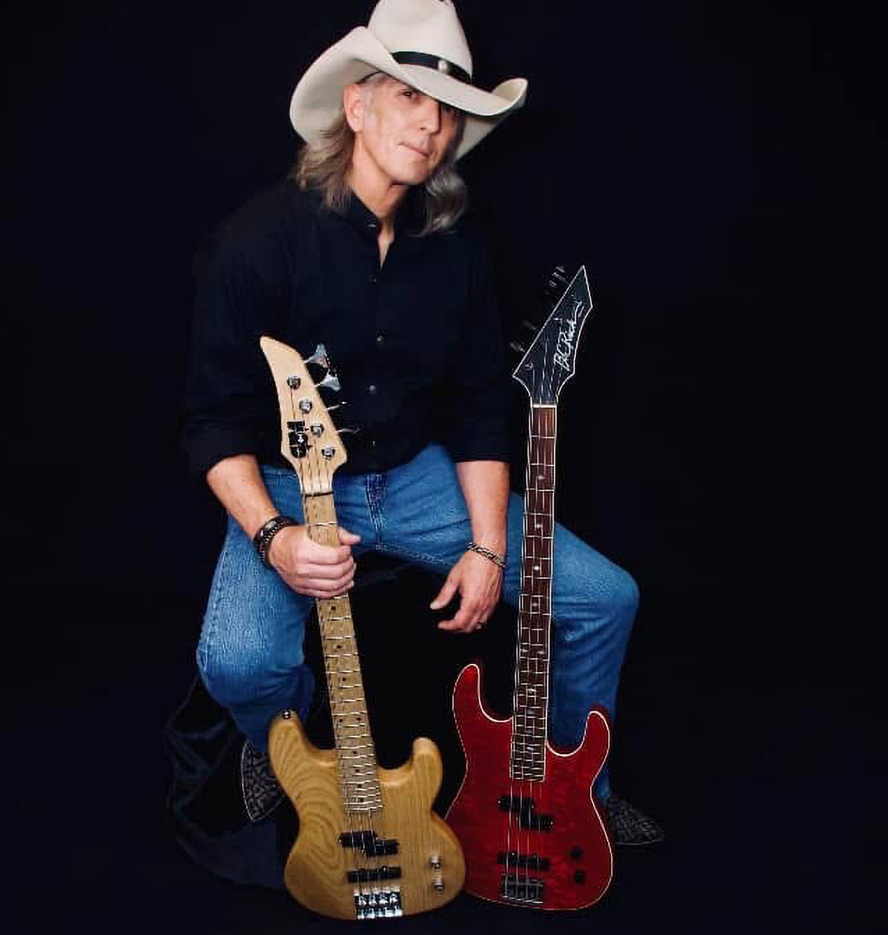Greg Chaisson, pictured with two of his basses