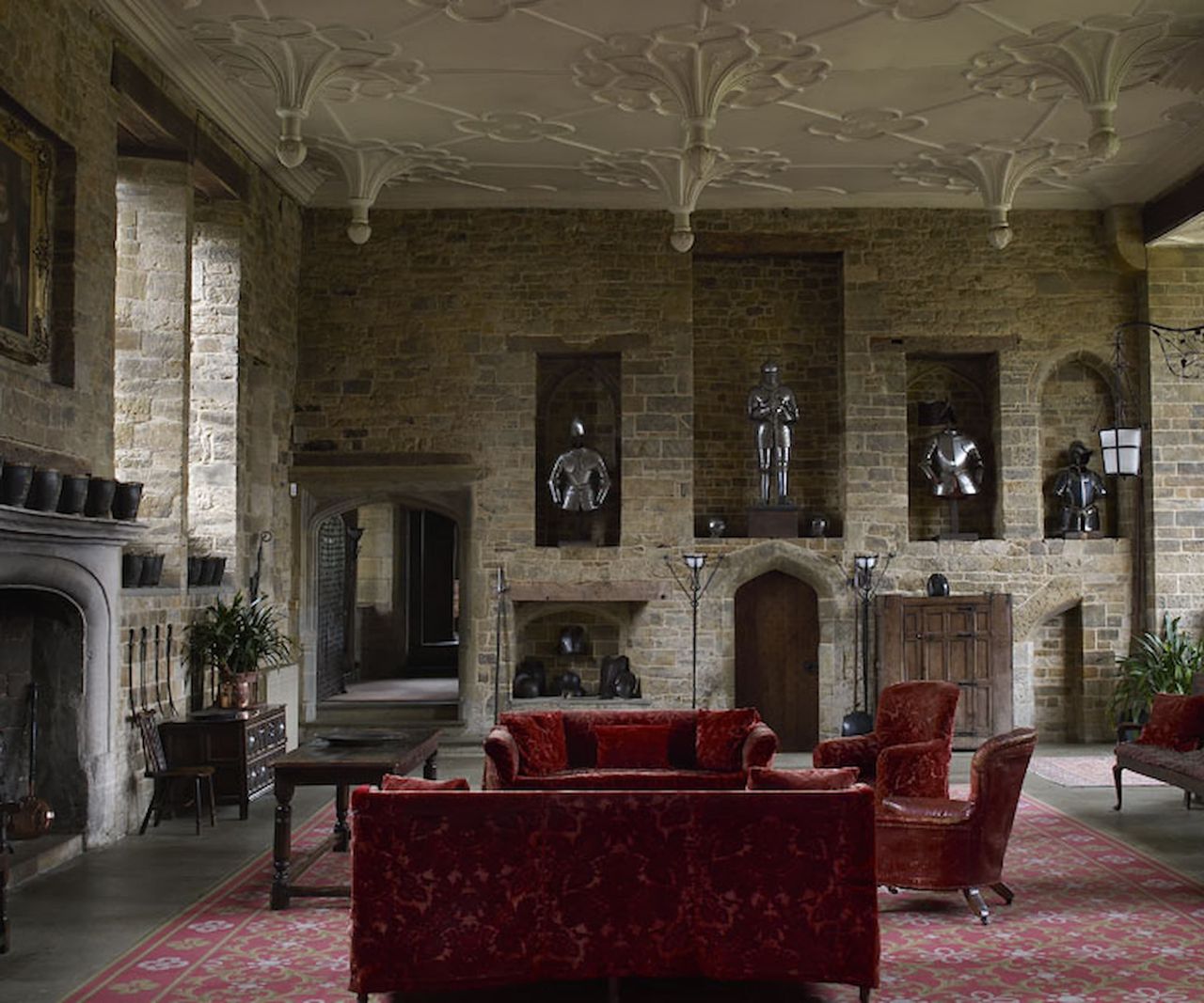 A hall with fireplace and stone walls