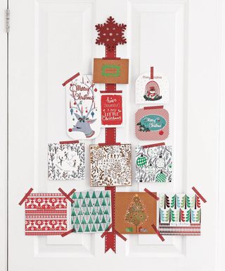 Christmas card display on white door