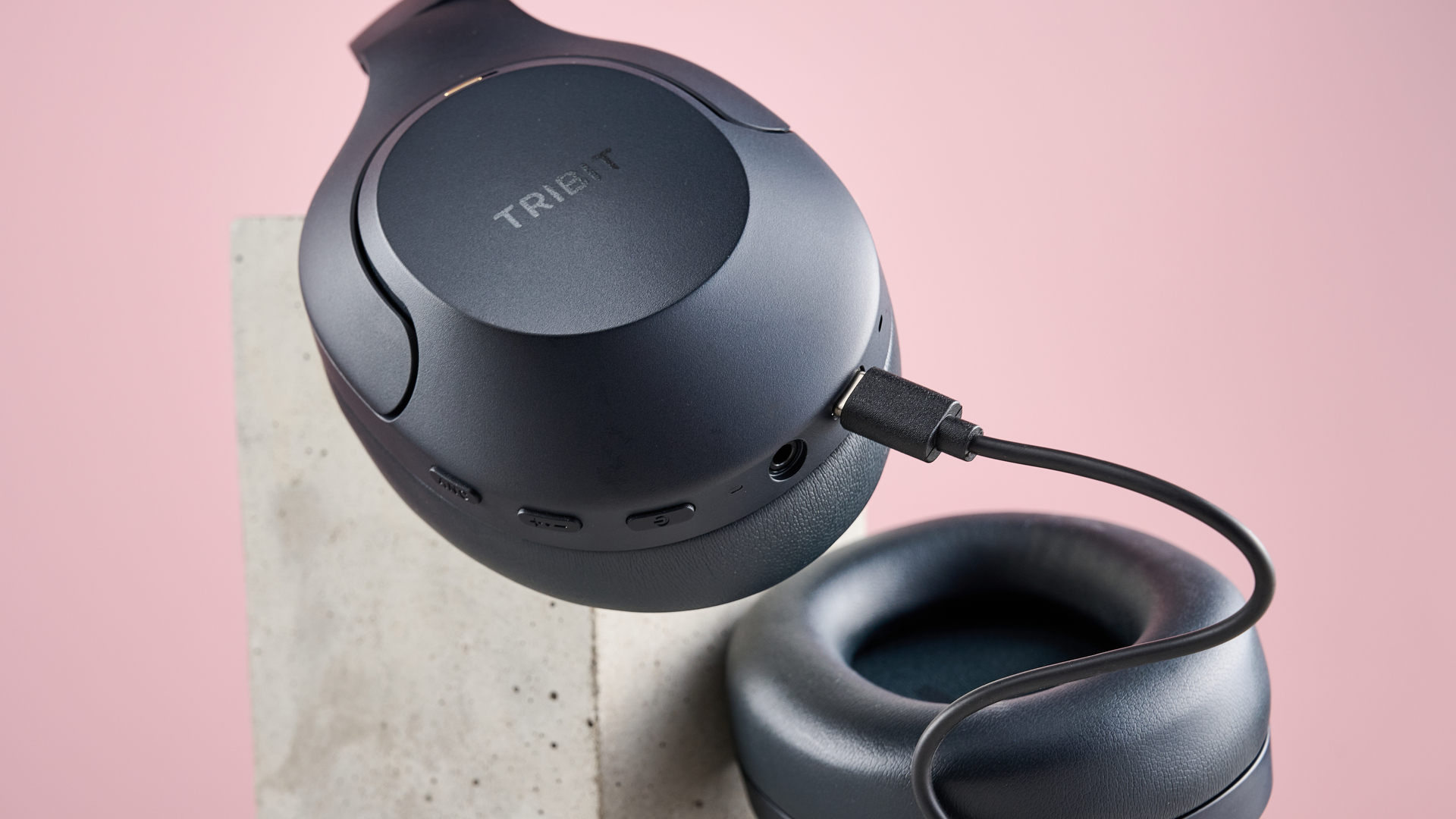 USB-C cable plugged into the Tribit QuietPlus 81