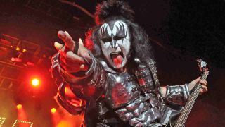 Gene Simmons of Kiss performing on stage in make-iup