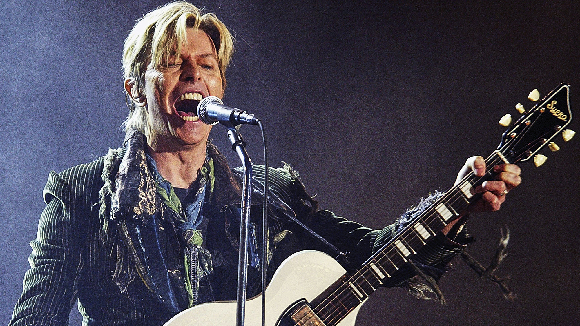 David Bowie performs on stage on the third and final day of "The Nokia Isle of Wight Festival 2004" at Seaclose Park, on June 13, 2004 in Newport, UK. The third annual rock festival takes place during the Isle of Wight Festival which runs from June 4-19. 