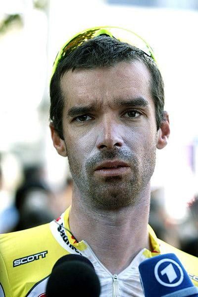 David Millar answers questions despite his apparent exhaustion