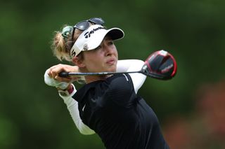 Korda watches her tee shot as she strikes driver off the tee