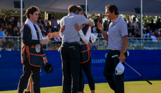 Tiger Woods hugs his family