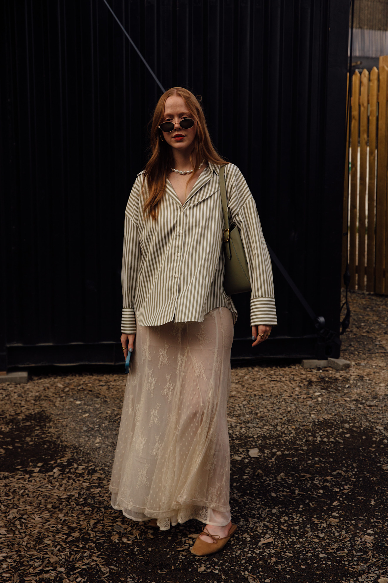 woman wearing button down and sheer skirt