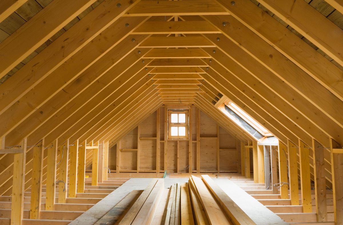 The inside of an attic that is to be converted