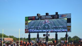 The scoreboard lit up at a football field powered by Electro-Voice.