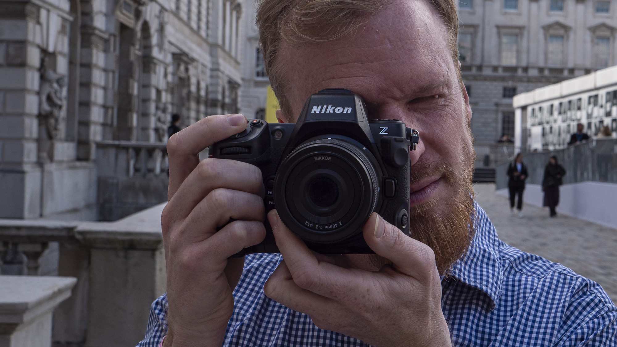 Nikon Z8 camera with user looking through viewfinder