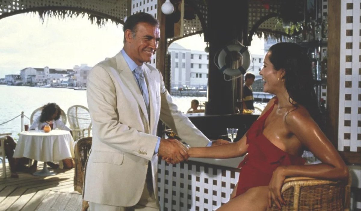 Sean Connery and Barbara Carrera shake hands in Never Say Never Again.