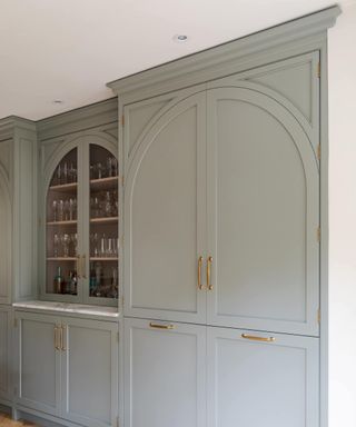 grey kitchen with arched doors
