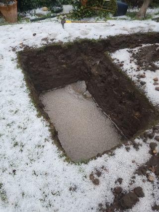 a hole dug for a drainage soakaway