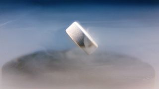 A superconductor floats above a magnet.