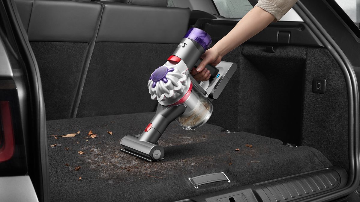 Dyson Car+Boat handheld being used in a car