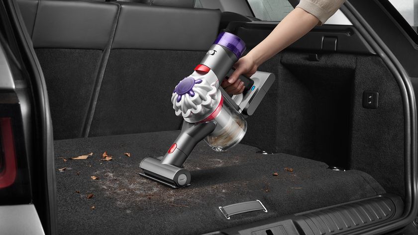 Dyson Car+Boat handheld being used in a car