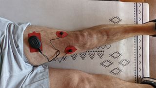Therabody PowerDot 2.0 attached to a thigh