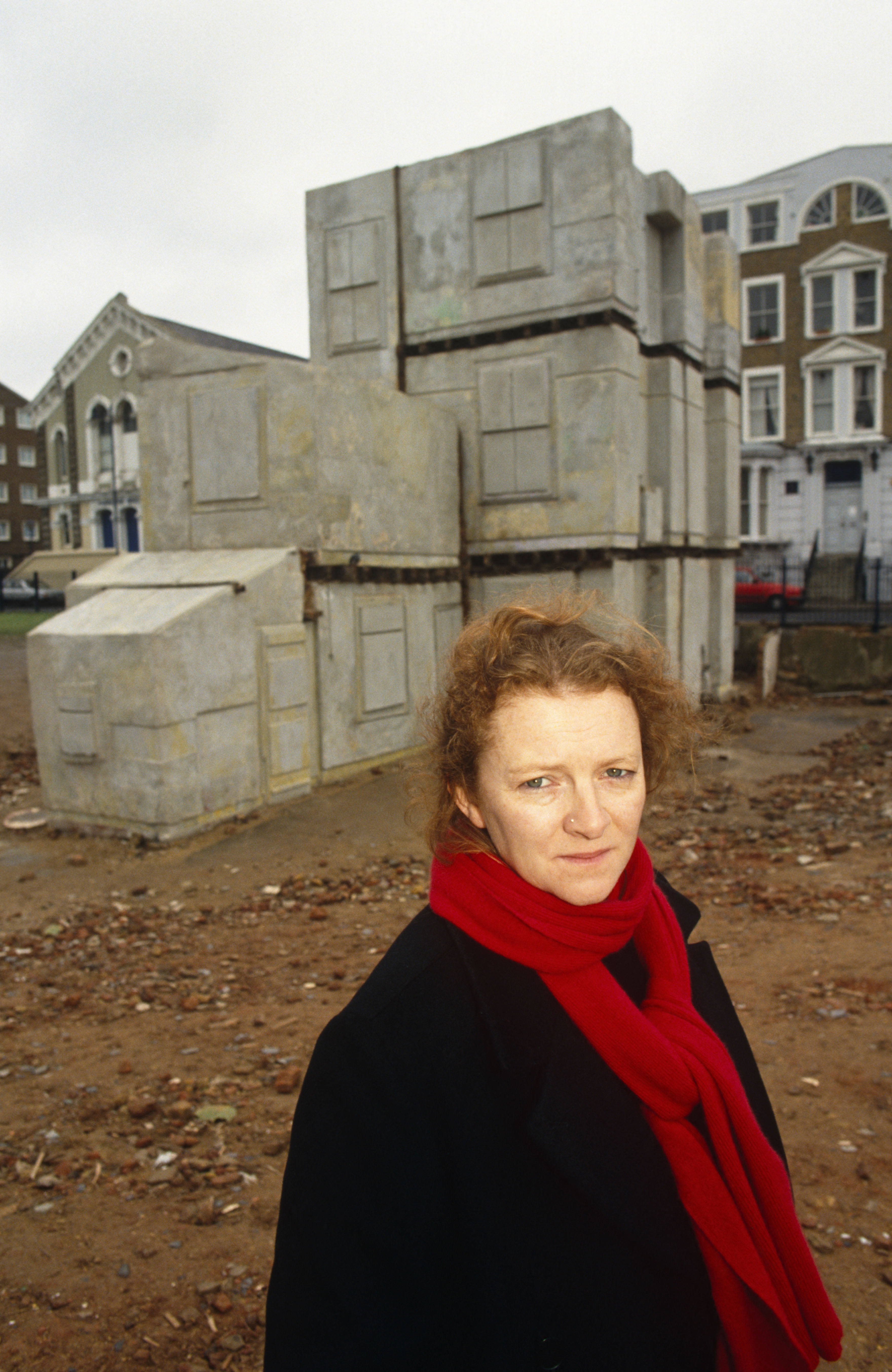 Rachel Whiteread stands near her sculpture creation 'House', winner of the 1993 Turner Prize art prize. It's a big old house made out of concrete, including the doors, windows, etc