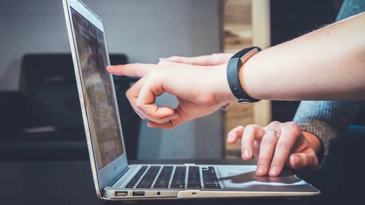 two people working on a laptop together