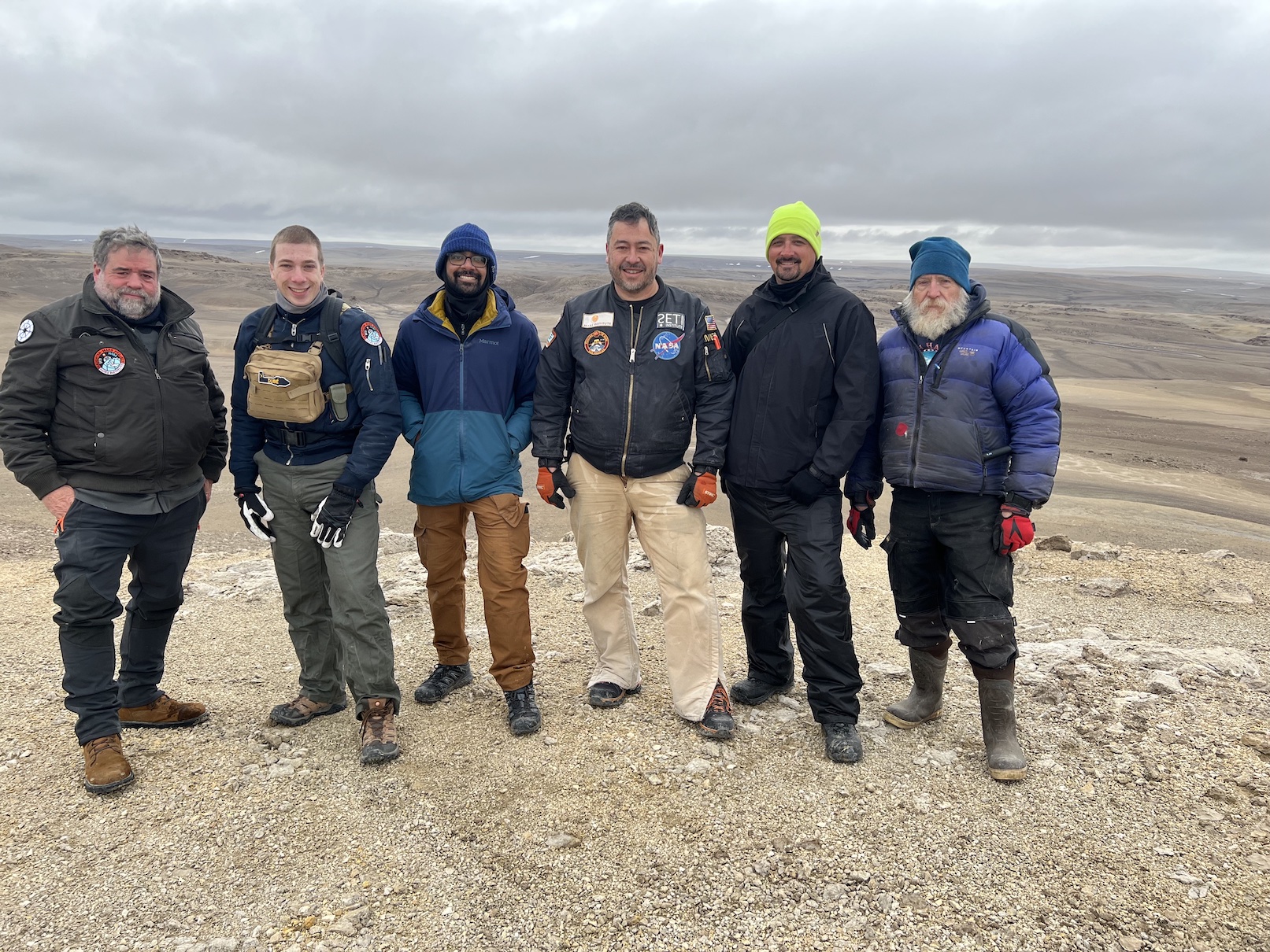 The team members of the 2022 Haughton-Mars Project pose for a group picture in the Arctic.