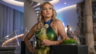 Kate Hudson holding a drink in Glass Onion