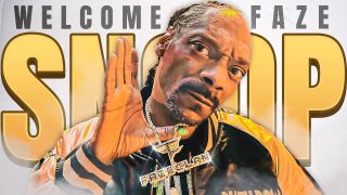 Snoop Dogg holds up a FaZe Clan necklace while posing in front of a sign reading "Welcome FaZe Snoop".